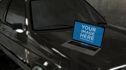 MacBook Pro Video Lying on a Car Hood a16257